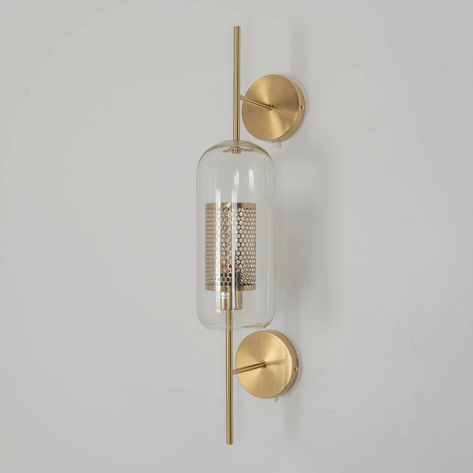 Honeycomb glass sconce illustrating mesh interior and honeycomb pattern design