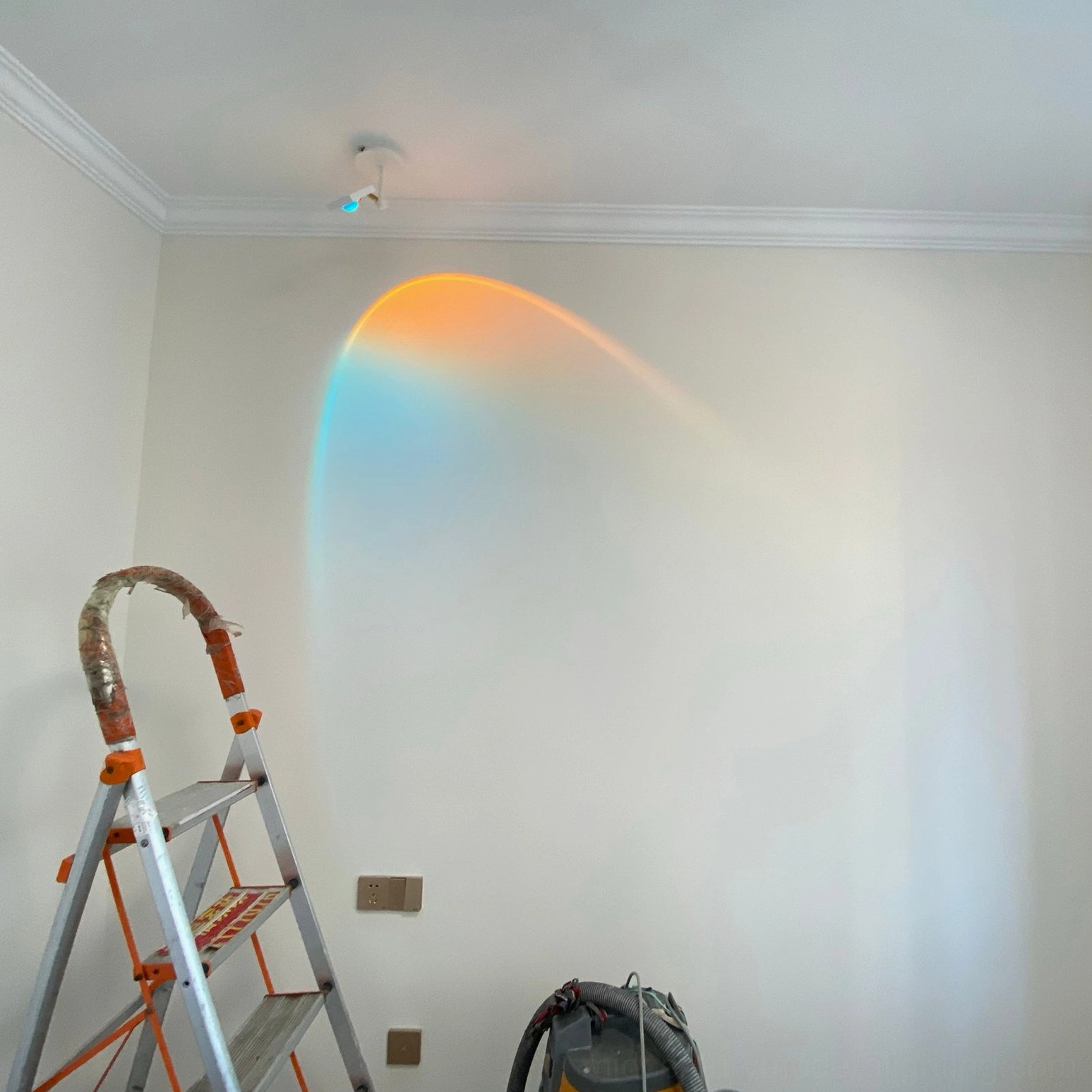 Sunset Halo Horizon projection blue orange gradient on white wall residential space