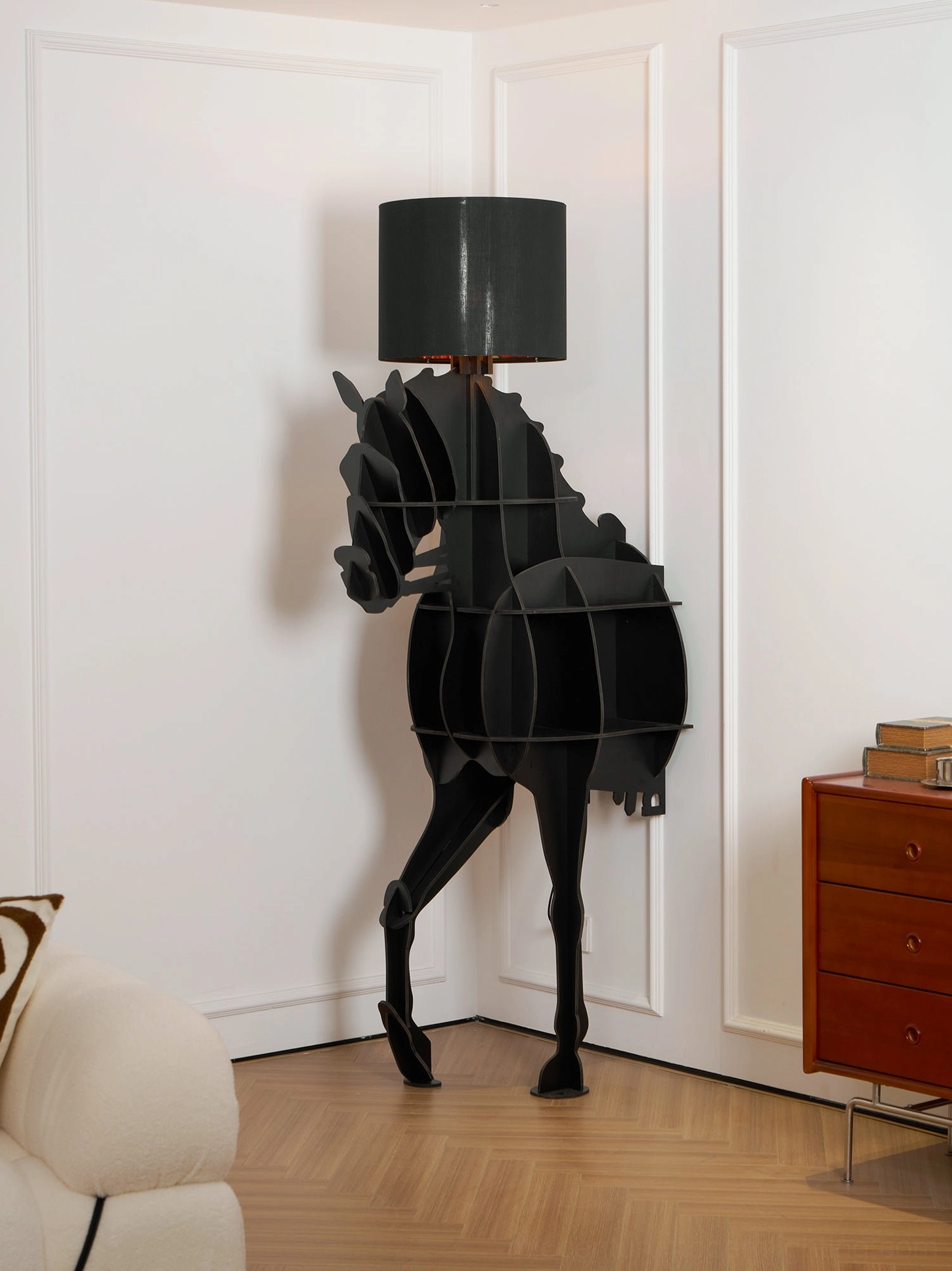 Horse floor lamp with integrated shelf positioned in living room corner with wooden side table, geometric horse form