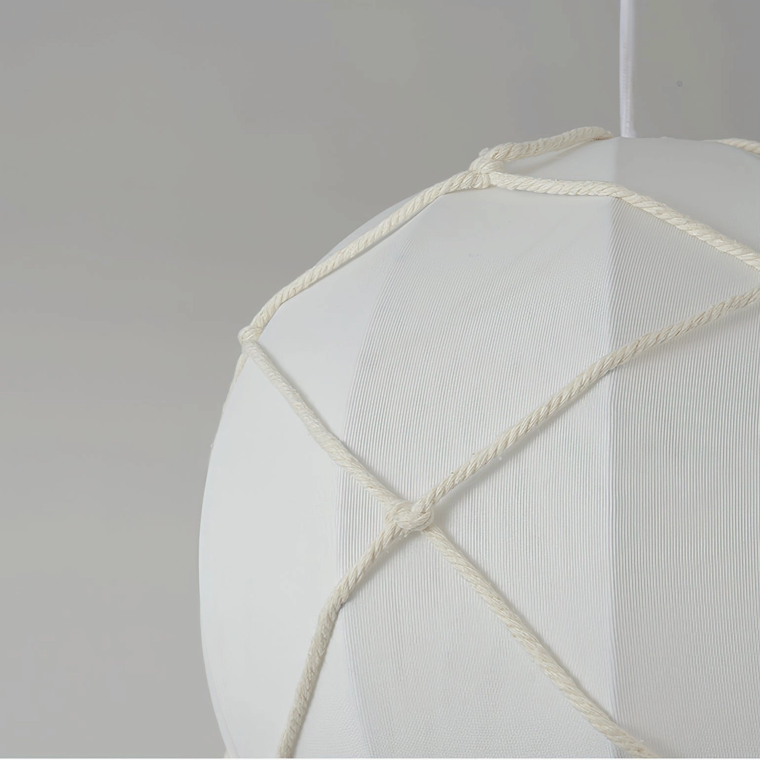 Hot air balloon pendant light showing sculptural form and organic rattan weave construction details