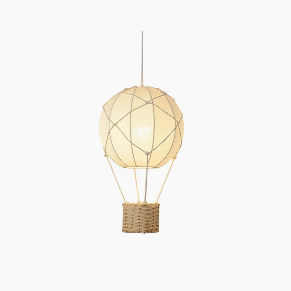 Hot air balloon pendant light with beige fabric shade and natural rattan basket base, front view on white background