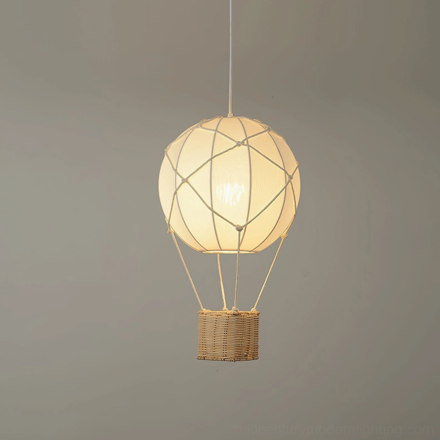 Close-up detail of hot air balloon pendant light showing illuminated bulb inside soft fabric shade