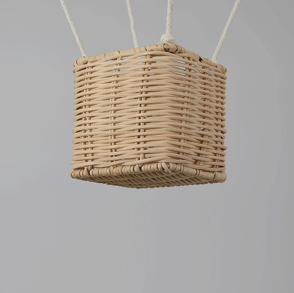 Hot air balloon fabric pendant light with natural rattan gondola base capturing mid-century modern aesthetic