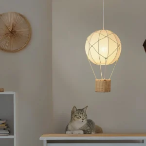 Hot air balloon fabric pendant light hanging in minimalist boho bedroom with warm ambient glow and tabby cat