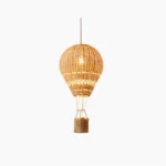 Hot air balloon rattan pendant light with handwoven natural basket weave design on white background