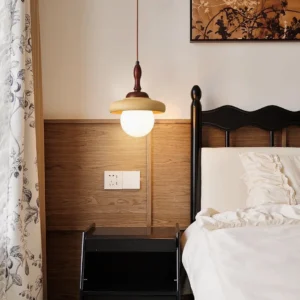 Humboldt pendant light installed in vintage bedroom above bedside, warm mid-century glow