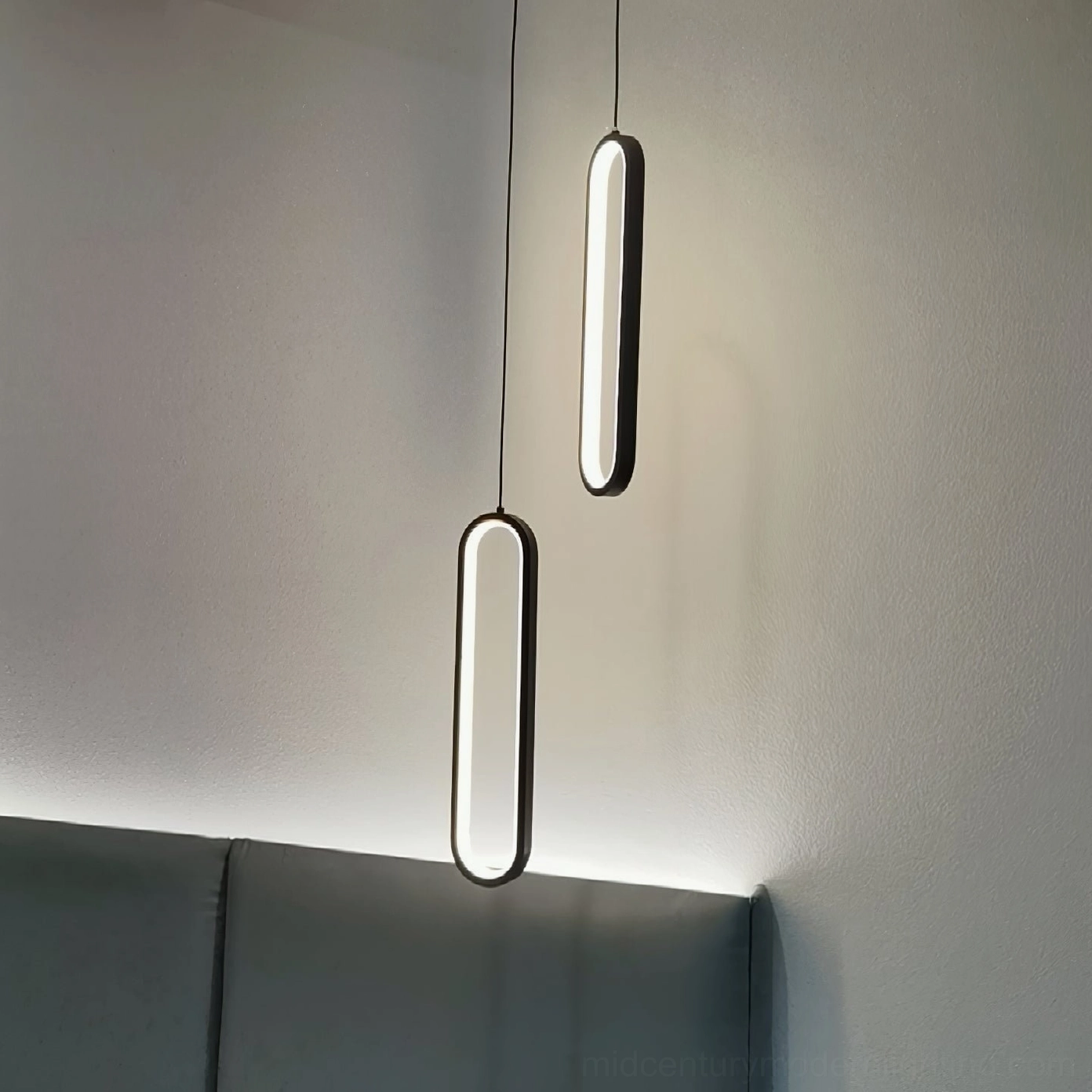 Huron double oval pendant lights bedroom headboard area slim black hanging cords warm glowing light