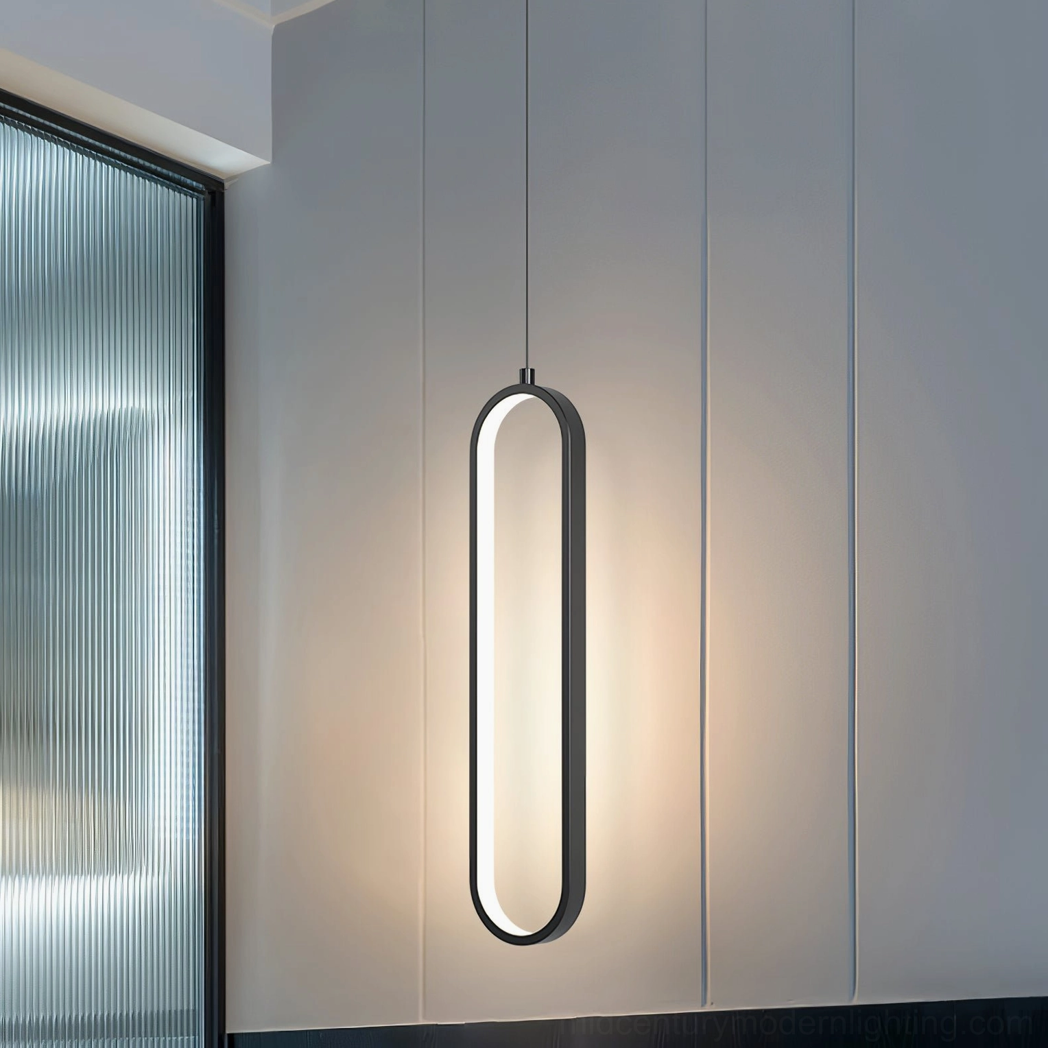 Huron single head pendant light minimalist living space black frame suspended from ceiling warm glow