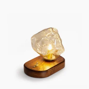 Ice glass table lamp with walnut wood base - front three-quarter view studio shot showing amber hand-blown glass shade and brass fixture