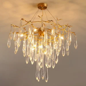 Icicle crystal pendant lamp installed in luxury living room with warm ambient lighting and polished brass frame