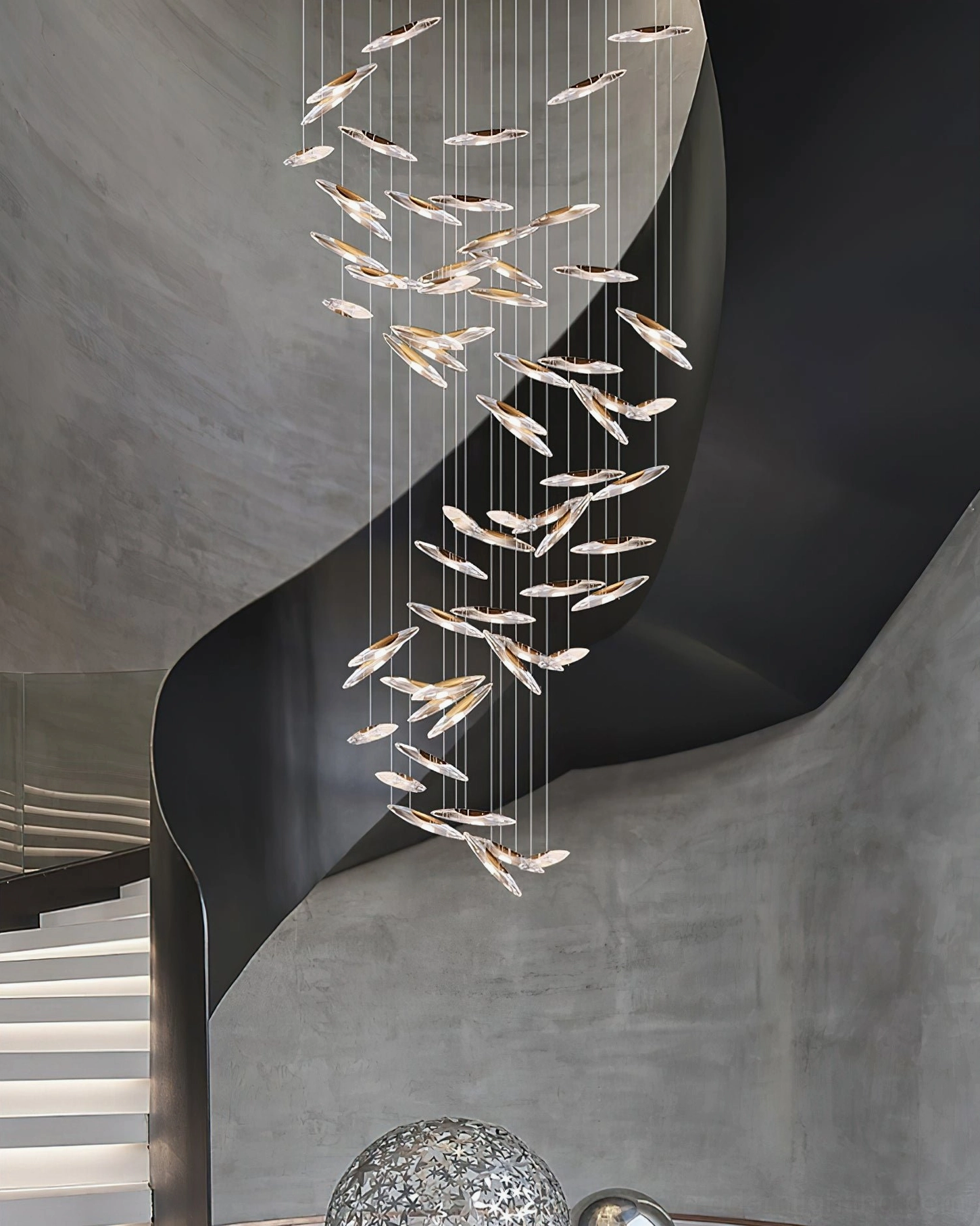 Illuminated cascading glass chandelier highlighting warm light diffusion through pendant elements