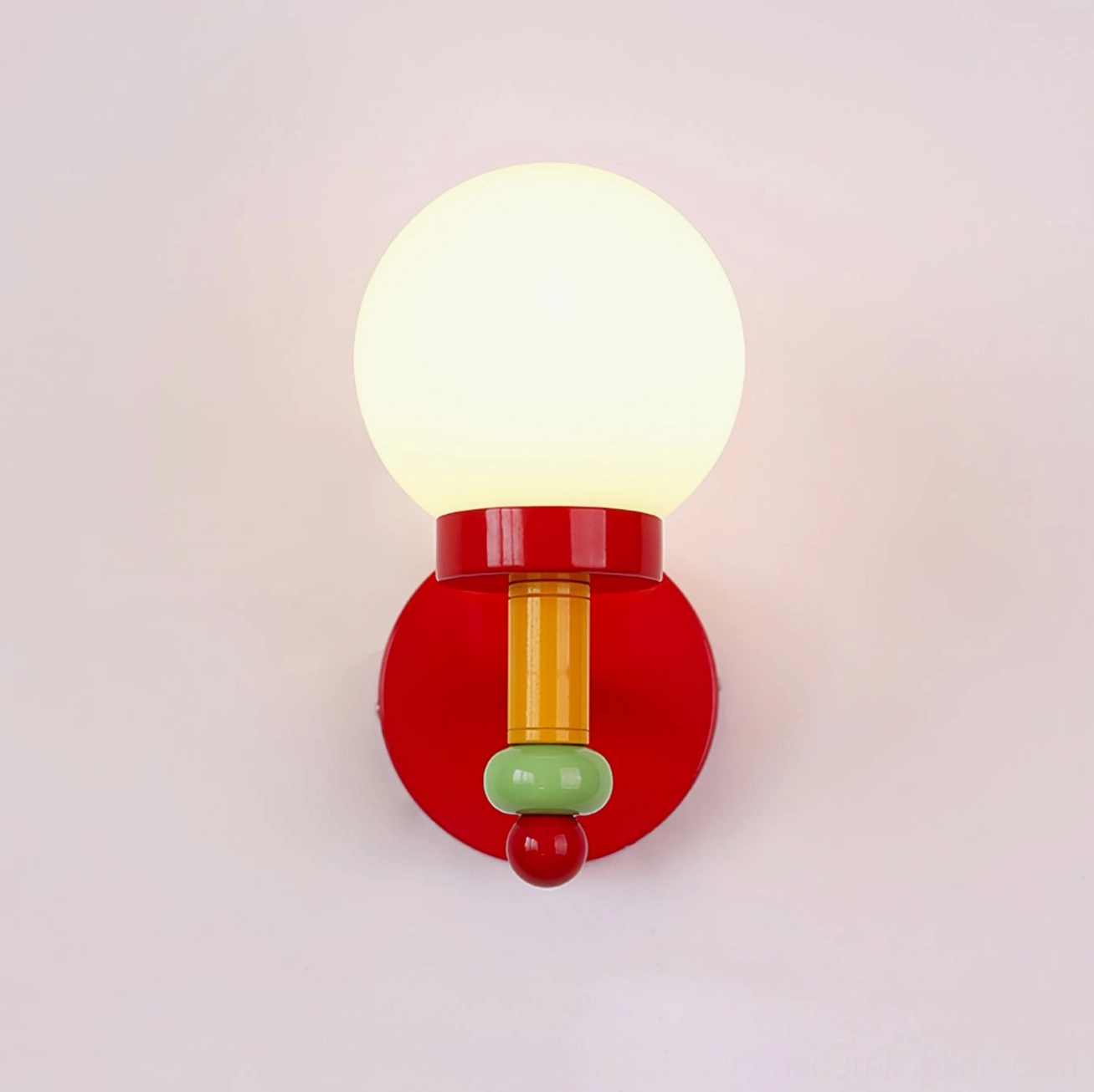 Fully illuminated glass globe wall sconce with frosted shade on white background
