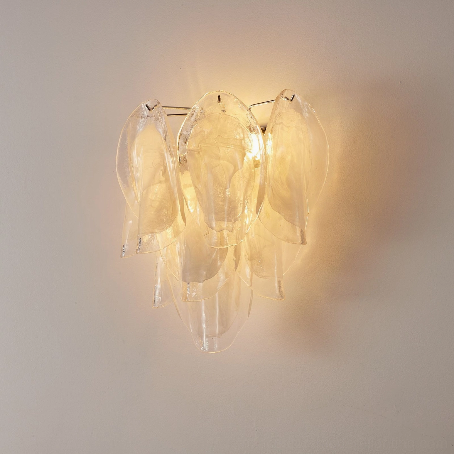 Ina sculptural wall sconce detail showing classic petal glass design and chrome fixtures