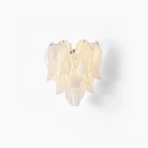 Ina frosted glass petal wall light illuminated with warm glow showing layered transparent petals