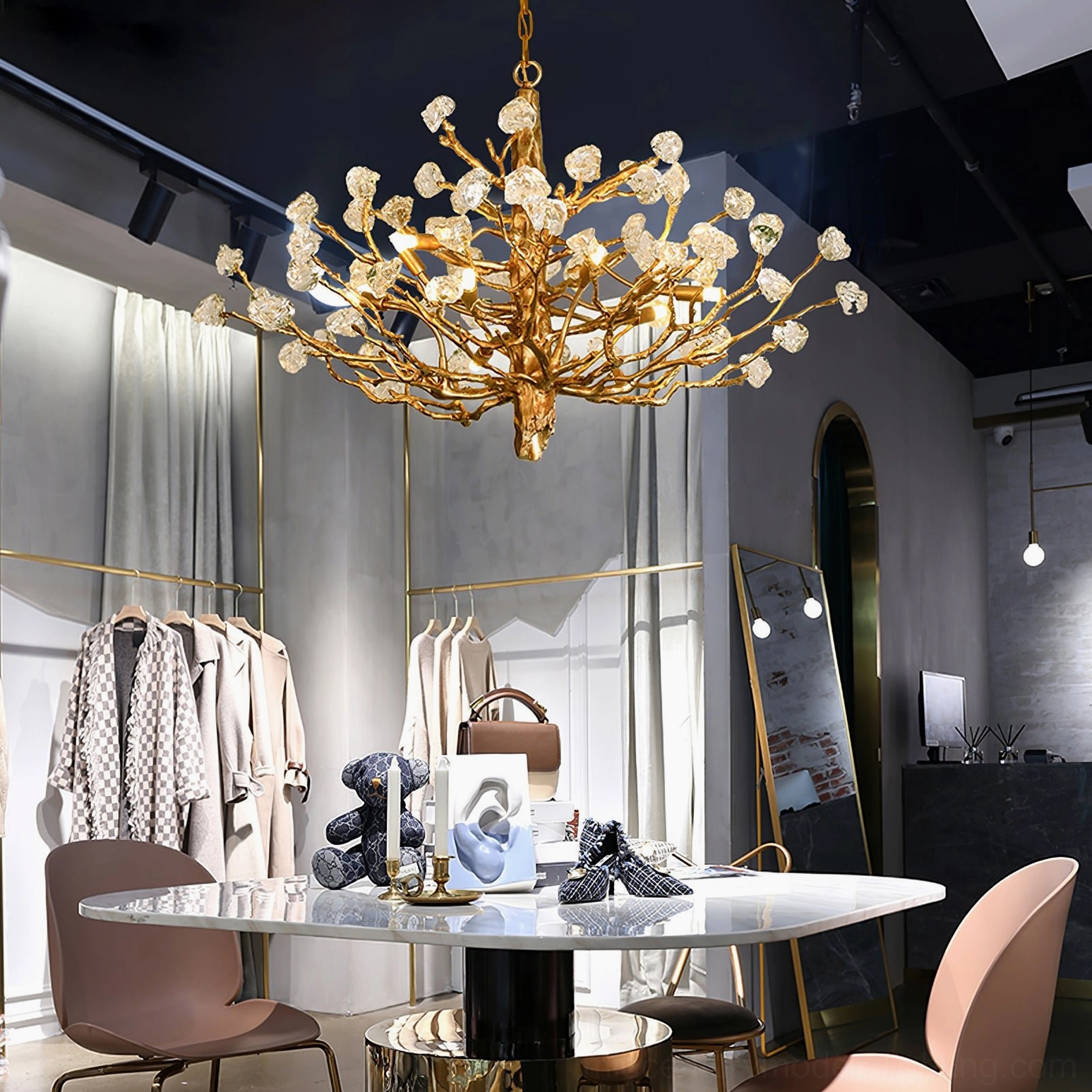 Industrial commercial retail space with large branch crystal chandelier overhead lighting design