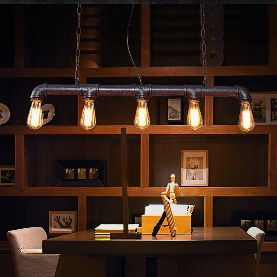 5-bulb industrial pipe pendant light in modern farmhouse dining room with bookshelves