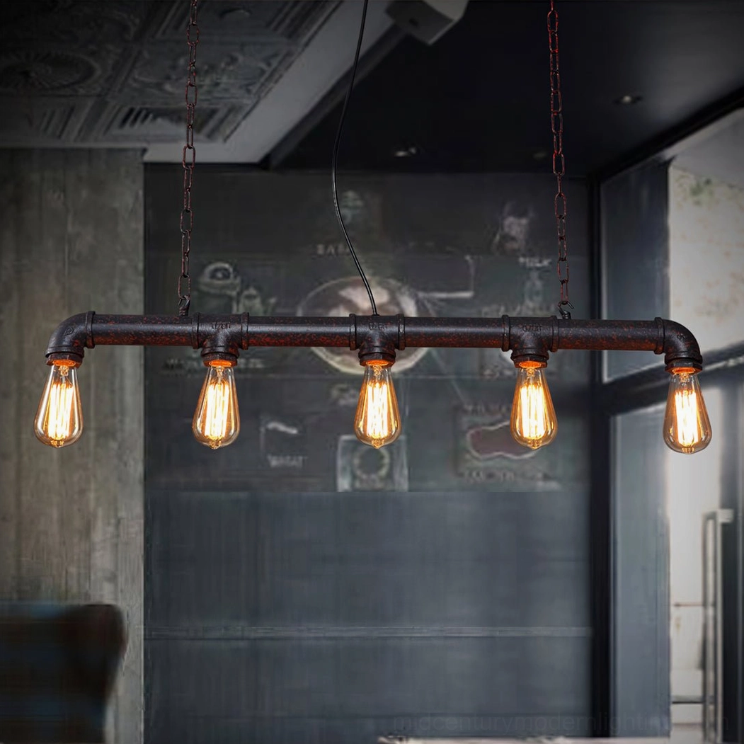 Linear industrial pipe pendant light fixture in retro bar environment with warm ambient lighting