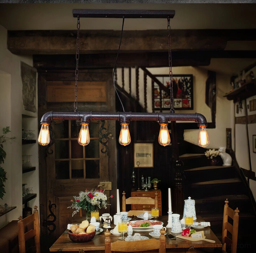 Farmhouse rustic industrial pipe pendant light in vintage home dining space with staircase