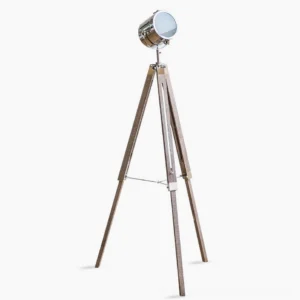 Industrial tripod floor lamp with adjustable spotlight head, polished chrome metal and camphor pine wood construction, front full-body view on white background
