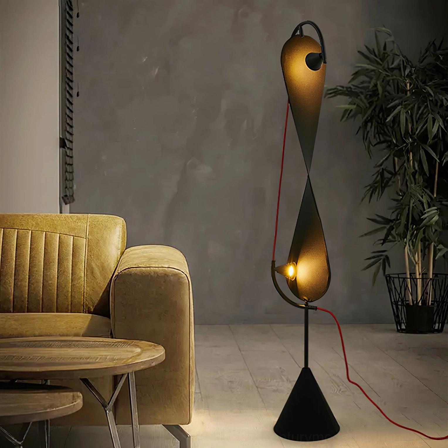Modern Infinite Floor Lamp positioned in contemporary living room with tan sofa, displaying ambient warm lighting and minimalist design