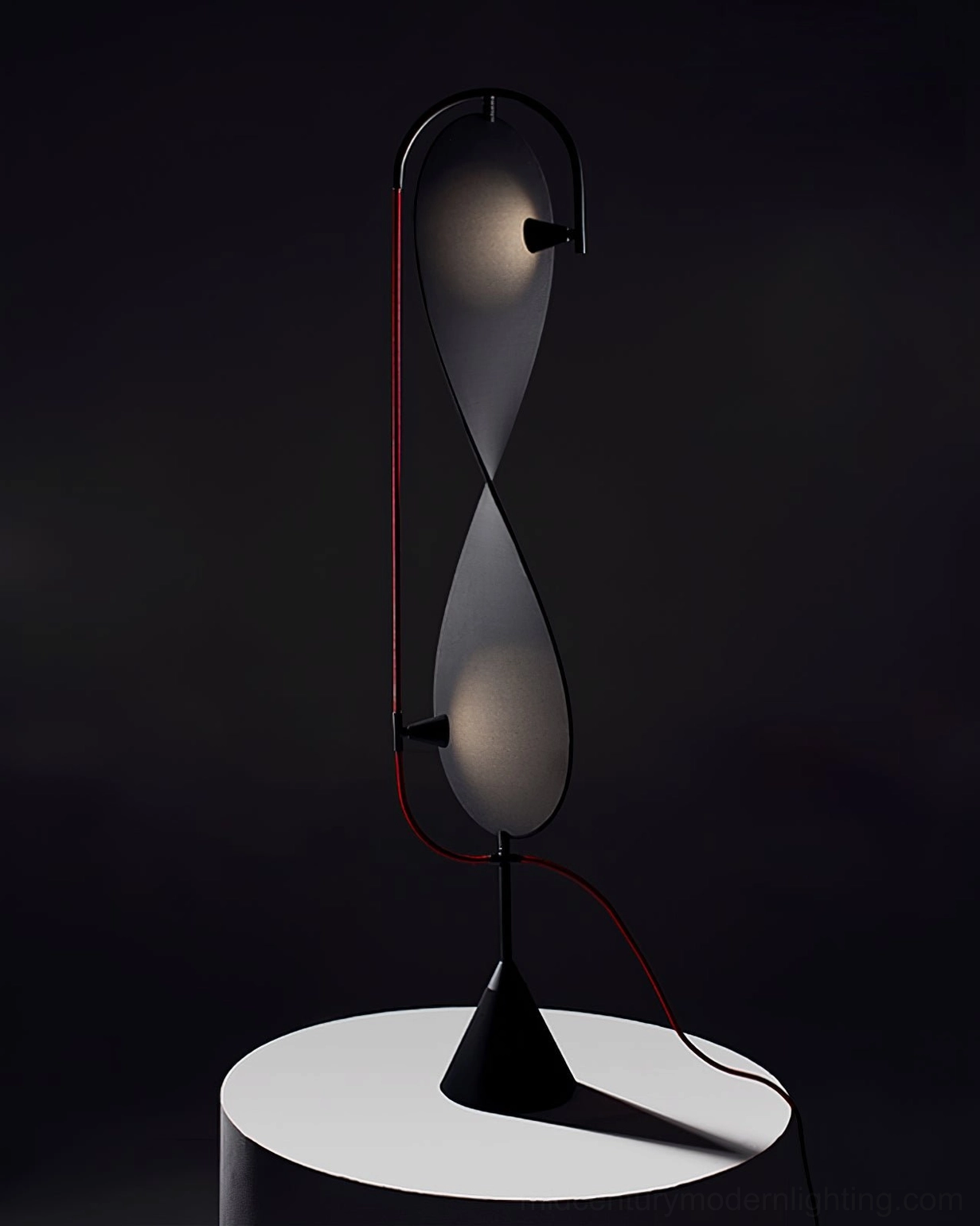Mid-century modern Infinite Floor Lamp in contemporary interior with minimalist furnishings and neutral palette
