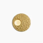 Infinity LED wall lamp with textured gold finish in minimalist dual-circle design, overhead studio view