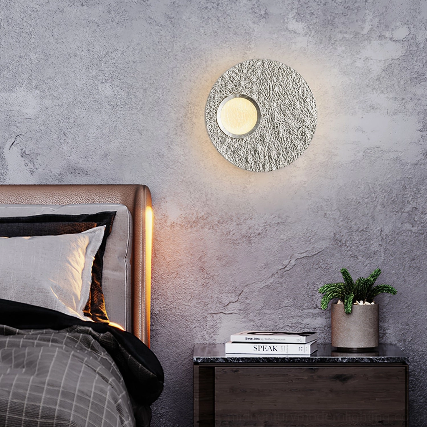 Silver Infinity LED wall lamp with warm glow mounted on concrete wall in minimalist modern bedroom