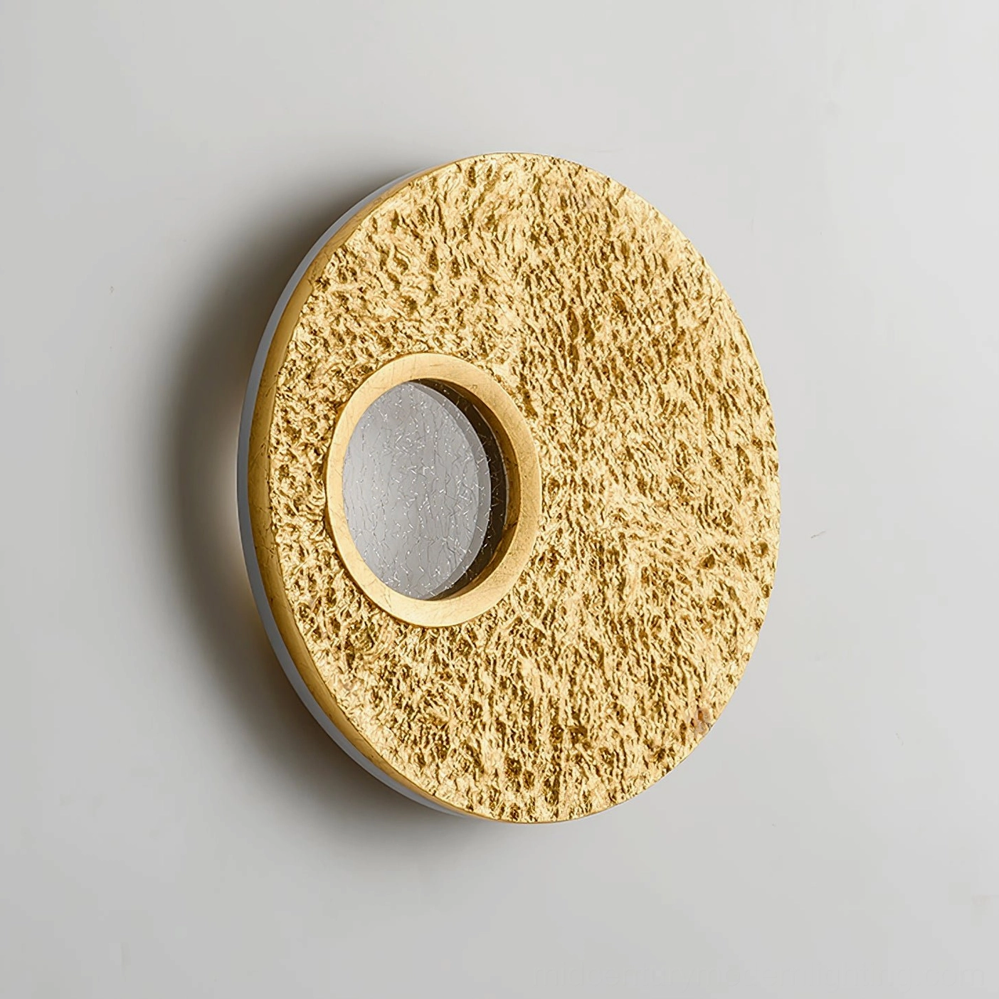 Dual-finish Infinity wall light with gold outer circle and silver inner nested design against light gray background