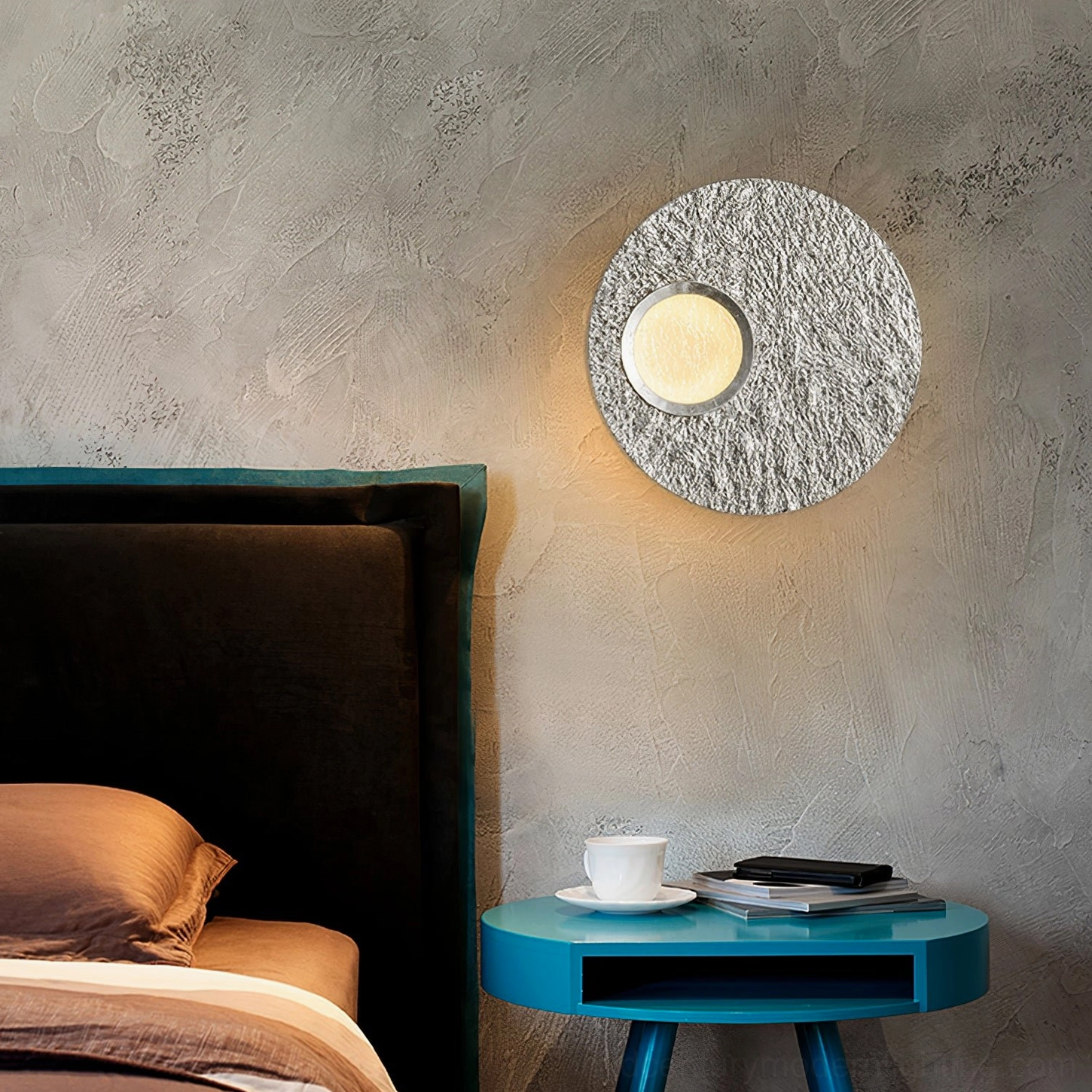 Infinity wall light fixture installation in luxury modern home showing sculptural lighting design
