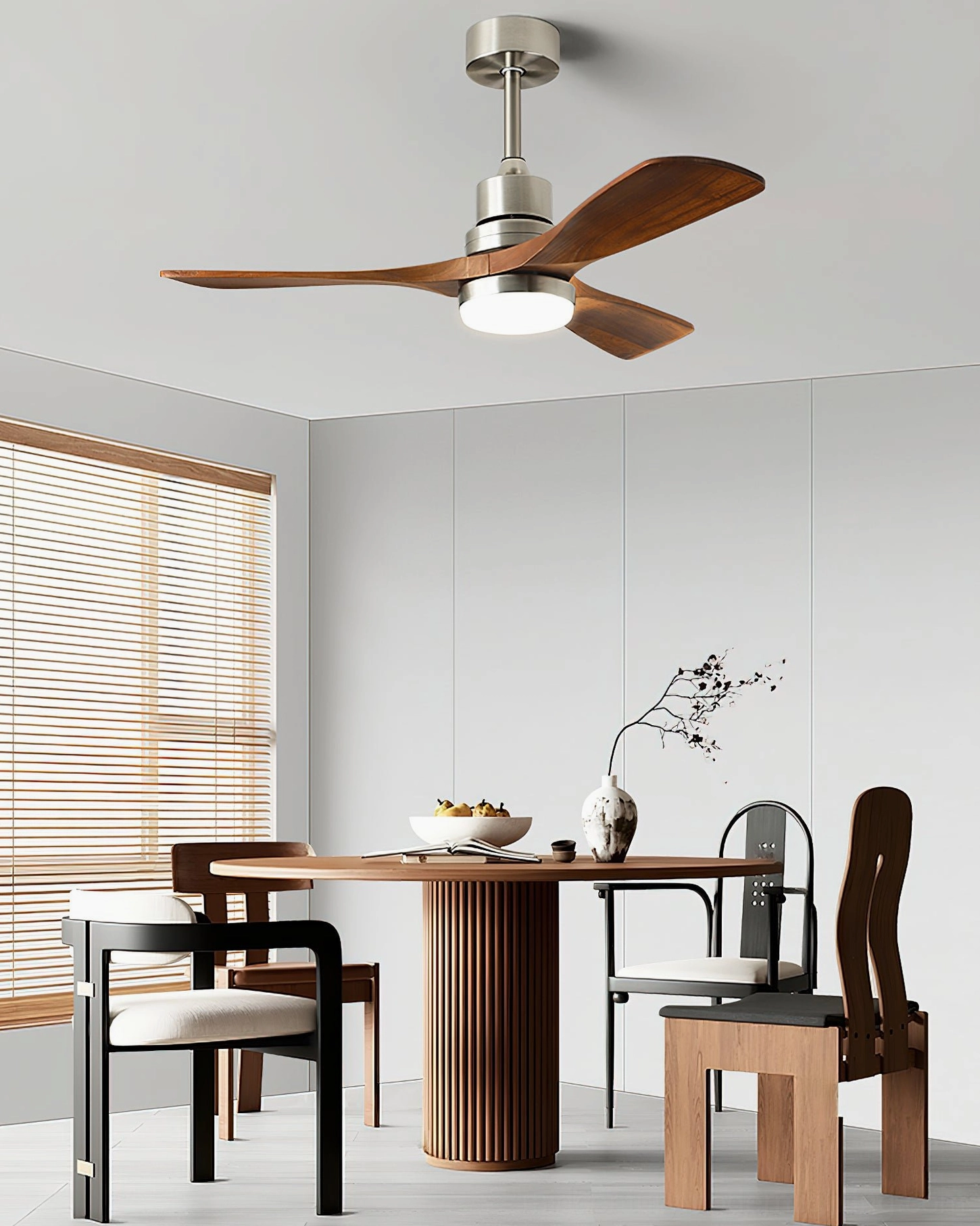 Integrated LED ceiling fan light in compact modern dining room, pedestal table with mixed-style chairs, contemporary interior design
