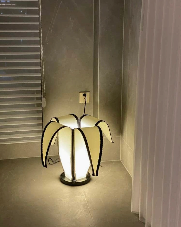 Interactive banana table lamp allowing personalized light adjustment throughout the day