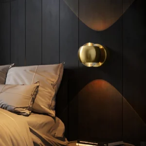Io Verticale wall lamp warm gold finish luxury bedroom accent lighting dark wood paneling