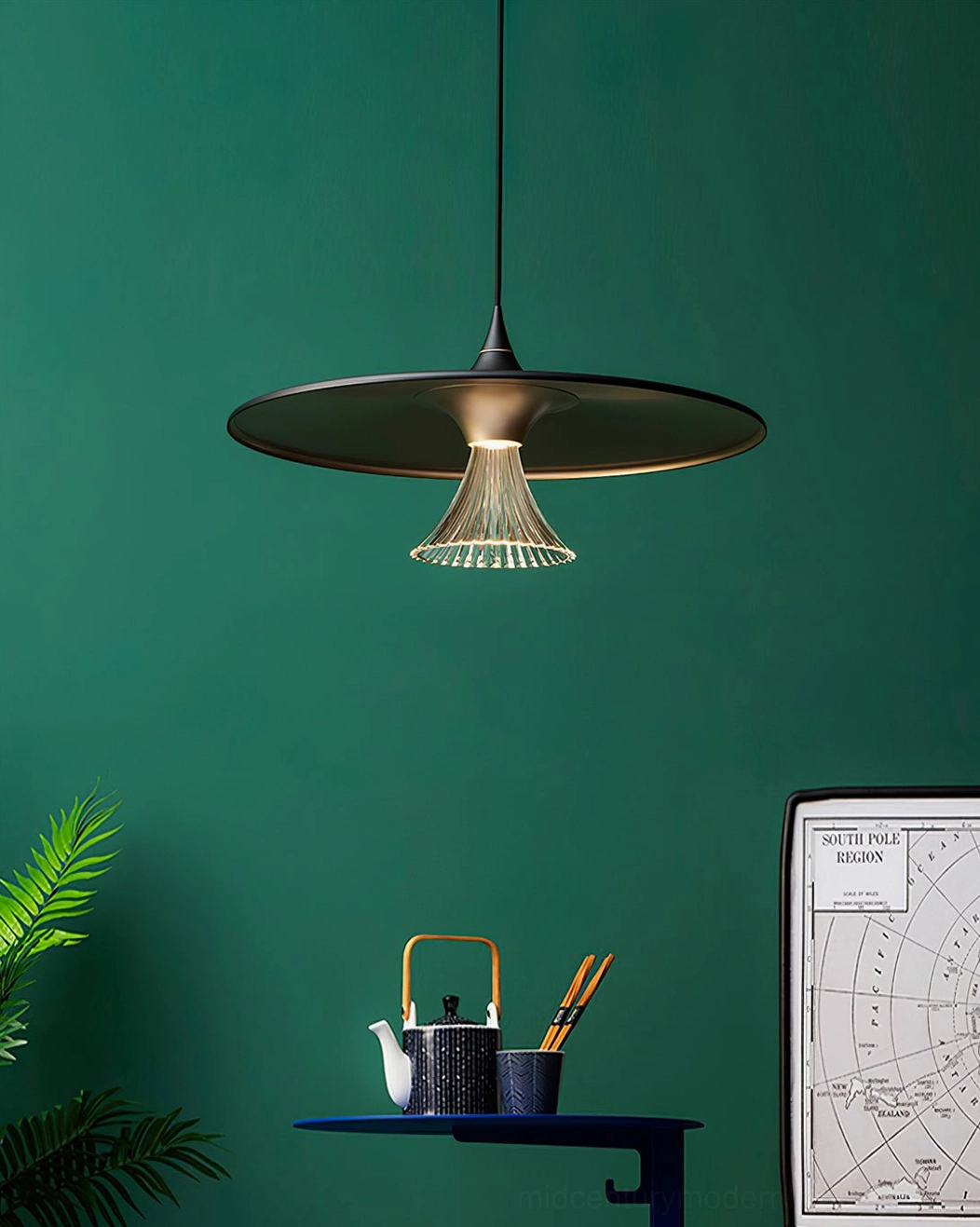 Ipho bronze-black pendant light with gold interior and fluted acrylic cover in cozy home corner