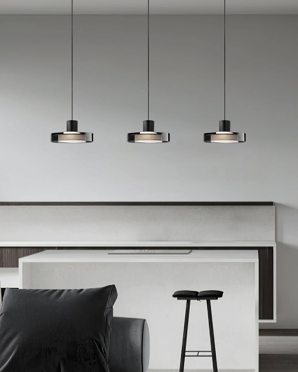 Three clustered Iris pendant lights in modern home bar lounge with linear matte black design
