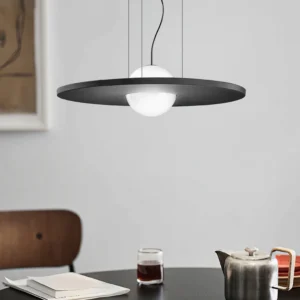 Irving Silence acoustic ceiling lamp installed in contemporary dining room, warm diffused light over modern dining table, mid-century modern pendant lighting
