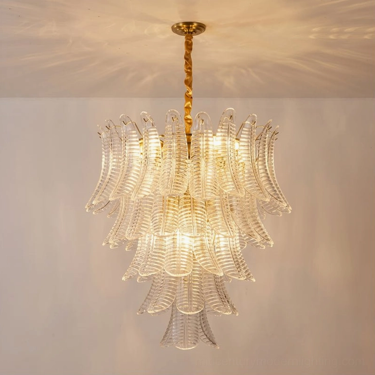 Large Isolde chandelier clear glass with gold hardware creating bright modern ceiling fixture statement piece