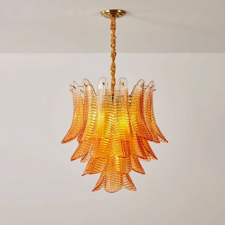 Medium Isolde chandelier amber and gold finish installed creating warm ambient interior lighting