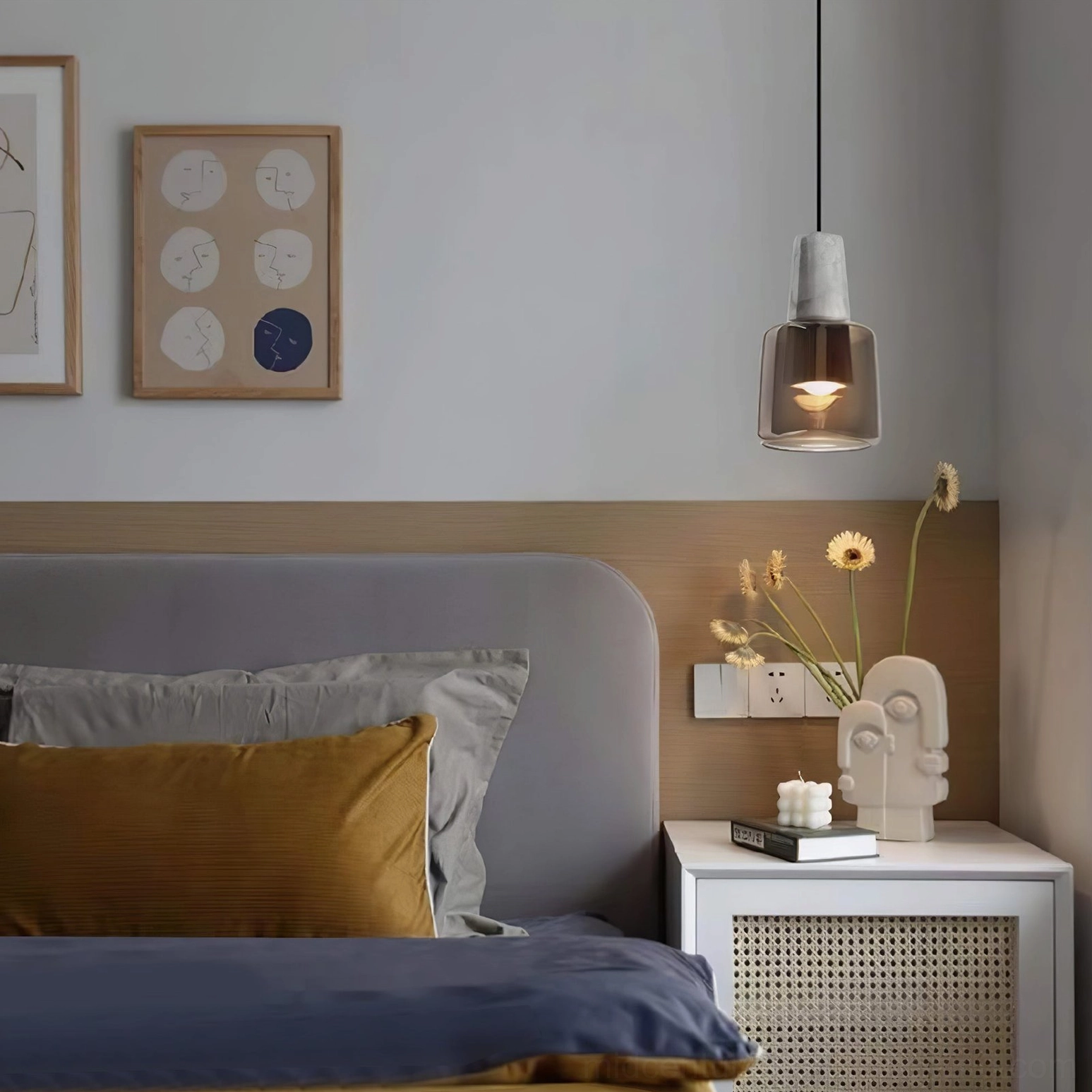 Issa pendant lamp in modern bedroom with fabric headboard front view eye level shot