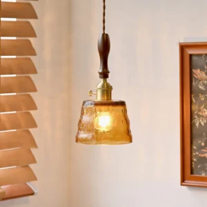 Jace vintage pendant light hanging in residential corner with warm interior lighting and fabric cord detail