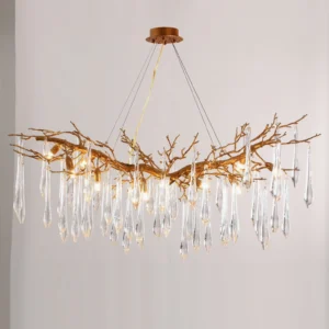 Janae crystal chandelier with suspension wires against minimalist light gray background, detail of hanging clear glass teardrop crystals