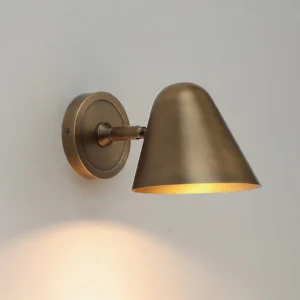 Janna Brass Wall Sconce side profile close-up - hand-brushed brass patina detail