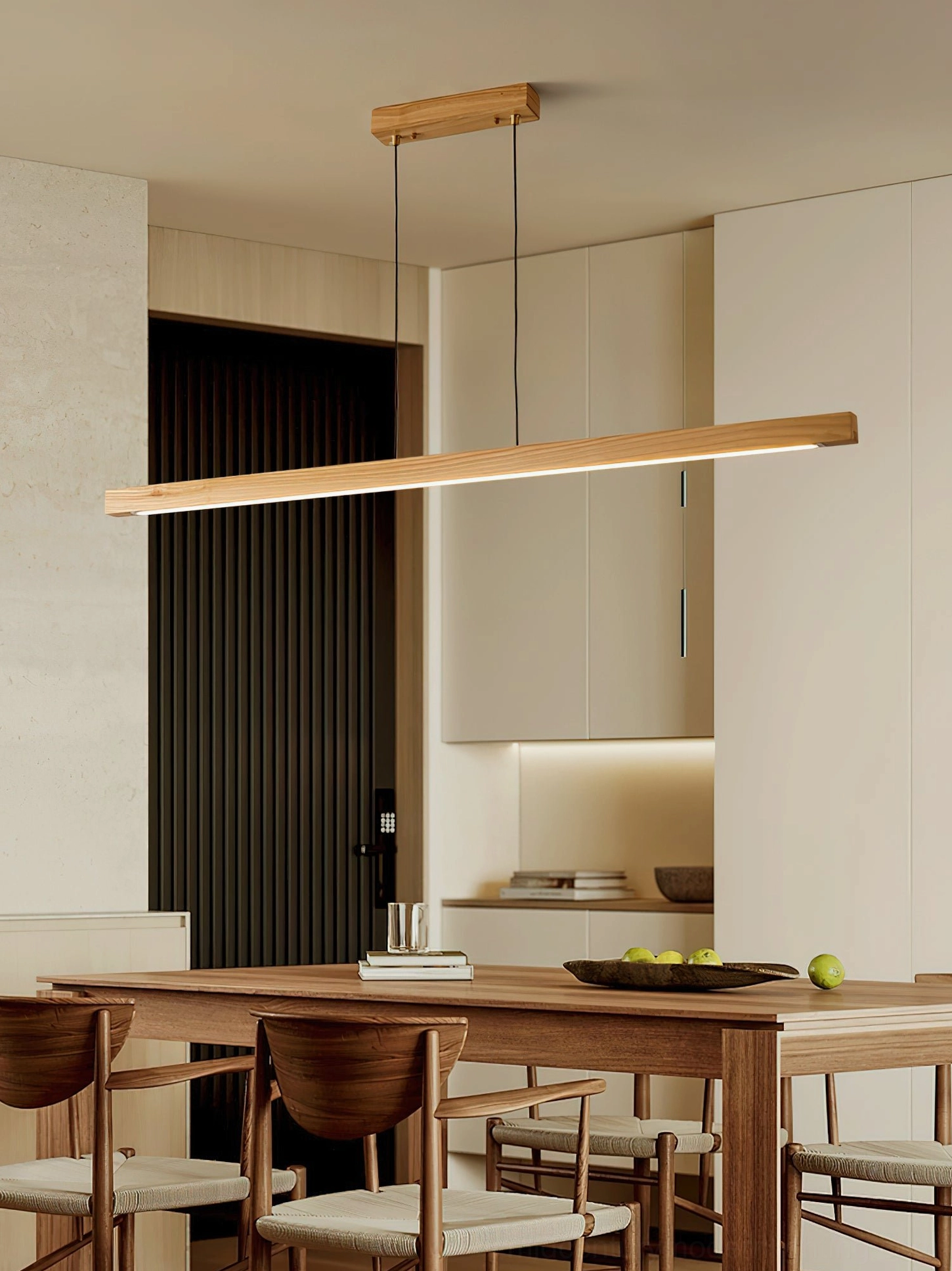 Natural wood linear pendant light in japandi-style open kitchen dining area with minimalist aesthetic