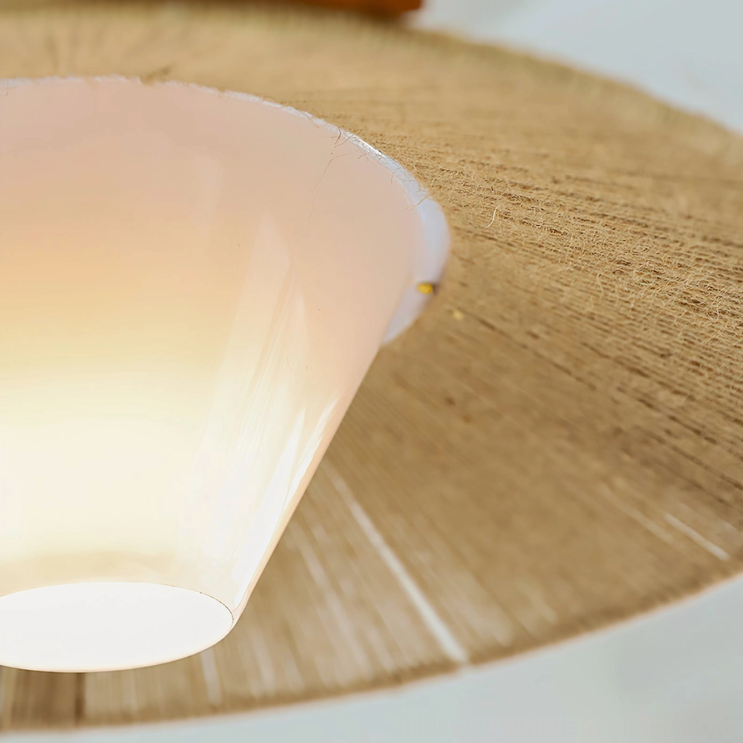Millier woven raffia pendant light lifestyle photo in contemporary home setting showcasing warm ambient glow and Japandi design aesthetic