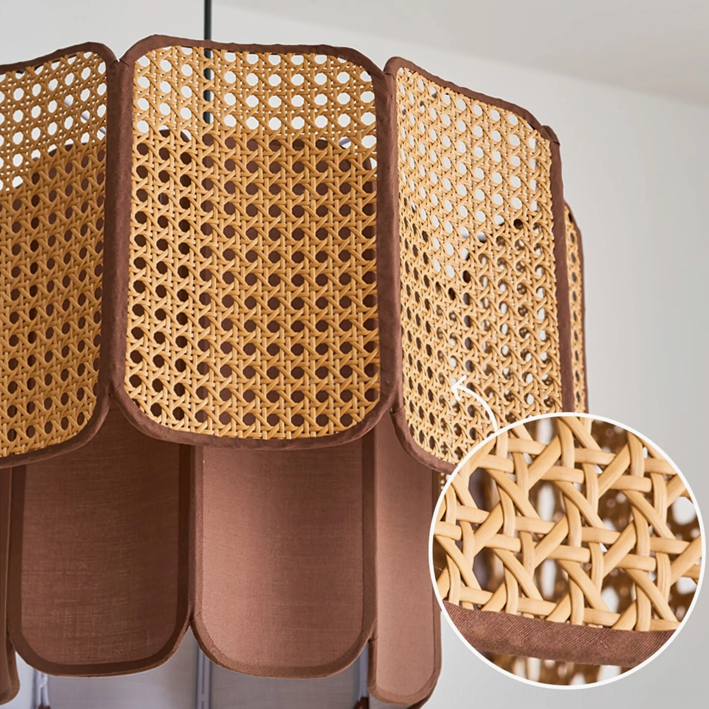 Jaras rattan pendant light in contemporary boho living room with natural fiber textiles and botanical elements