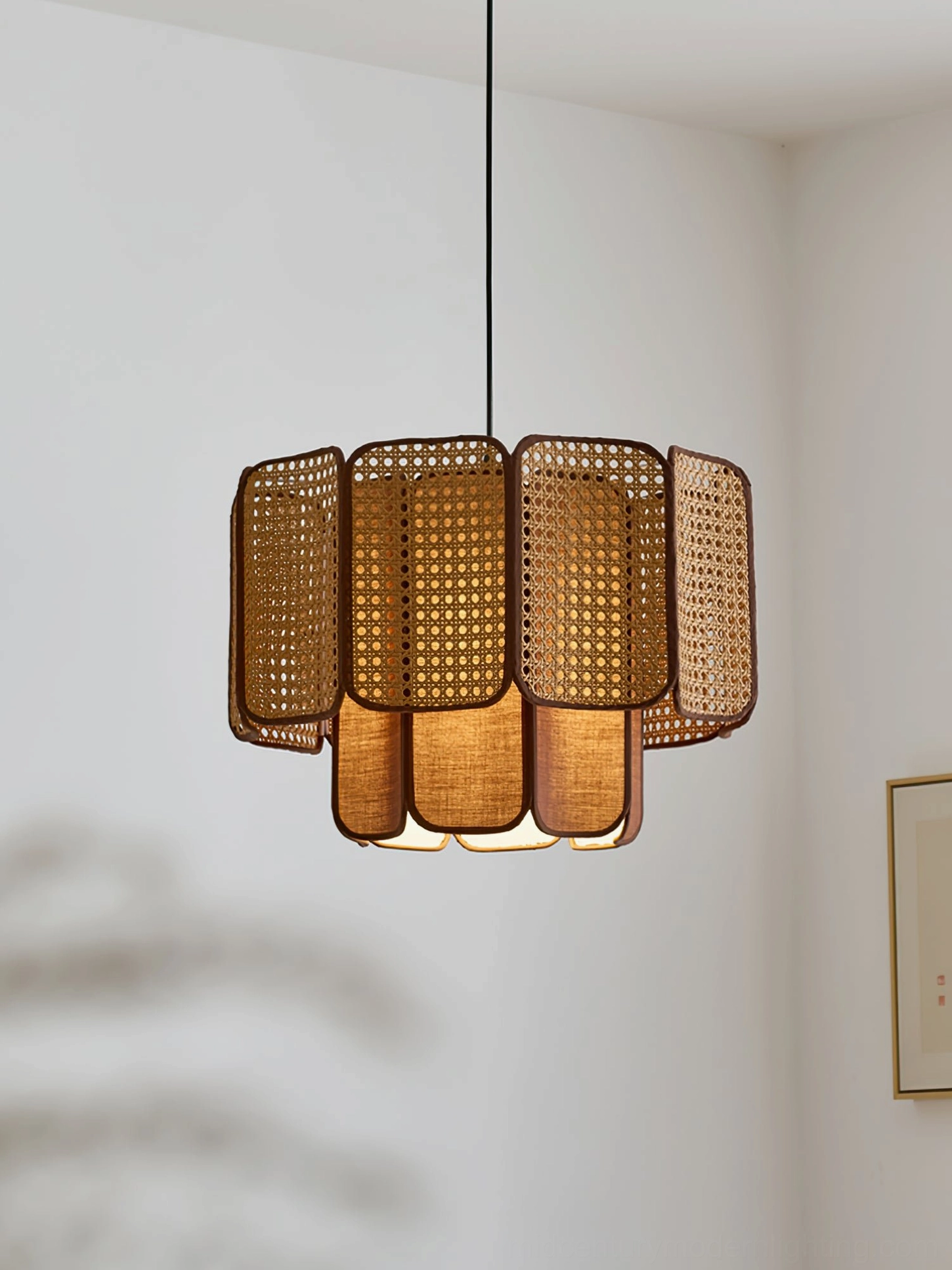 Jaras coffee stained rattan pendant light in warm transitional interior with mid-century furniture styling