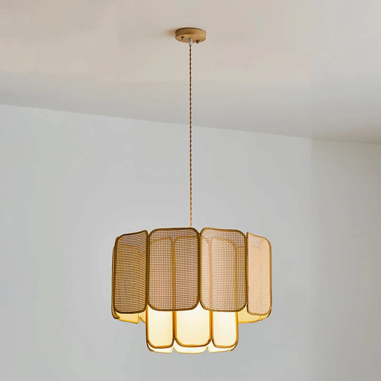 Jaras natural rattan pendant light three-quarter view in minimalist Scandinavian interior with warm ambient glow