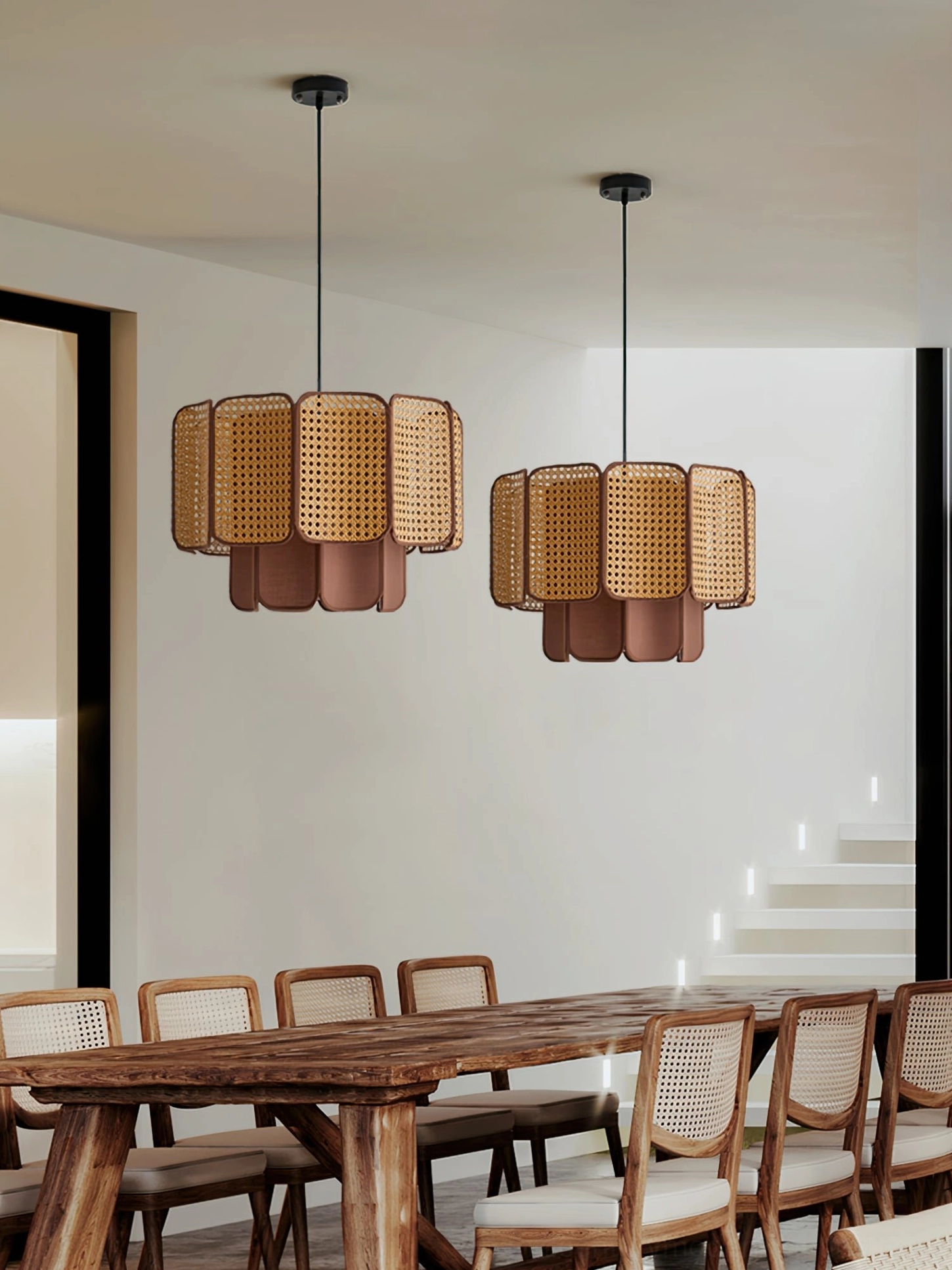 Pair of matching Jaras rattan pendant lights in commercial dining hall creating cozy rustic dual fixture installation
