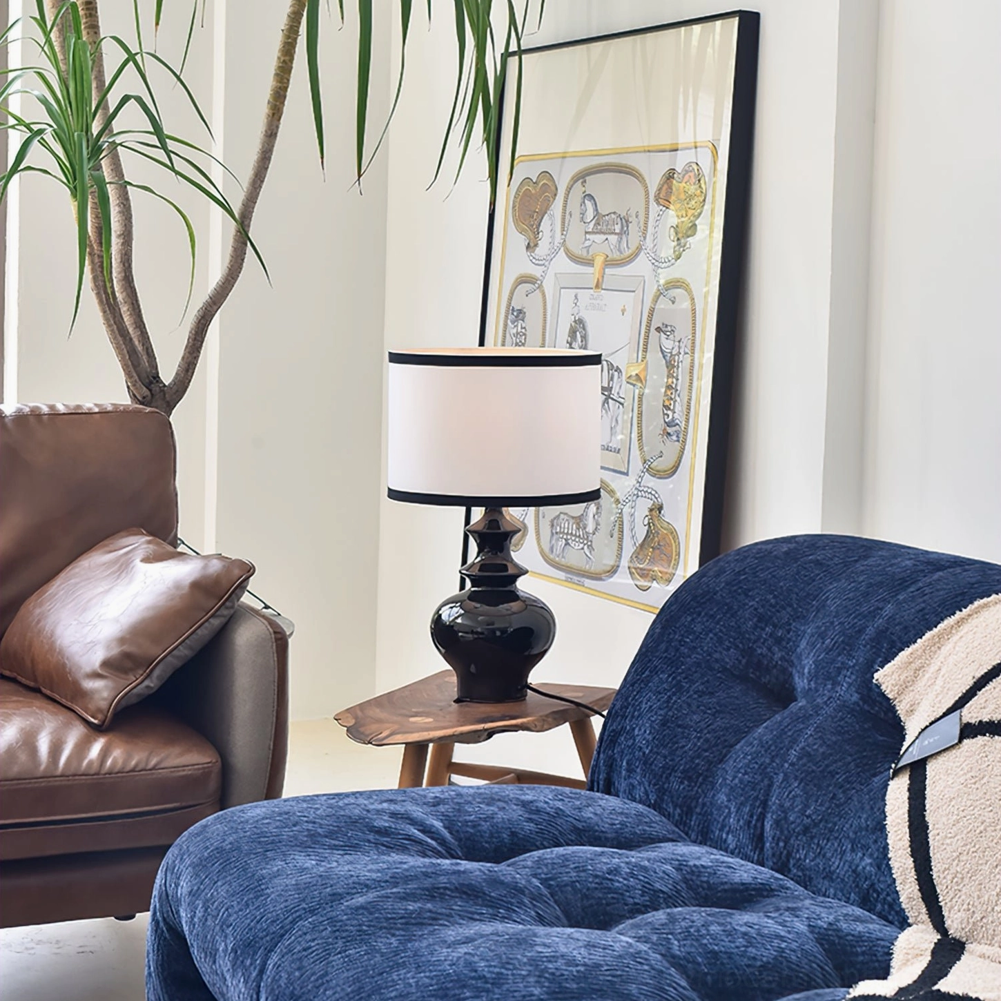 Jarrige table lamp on wooden accent table beside blue fabric sofa, contemporary living room ambient lighting