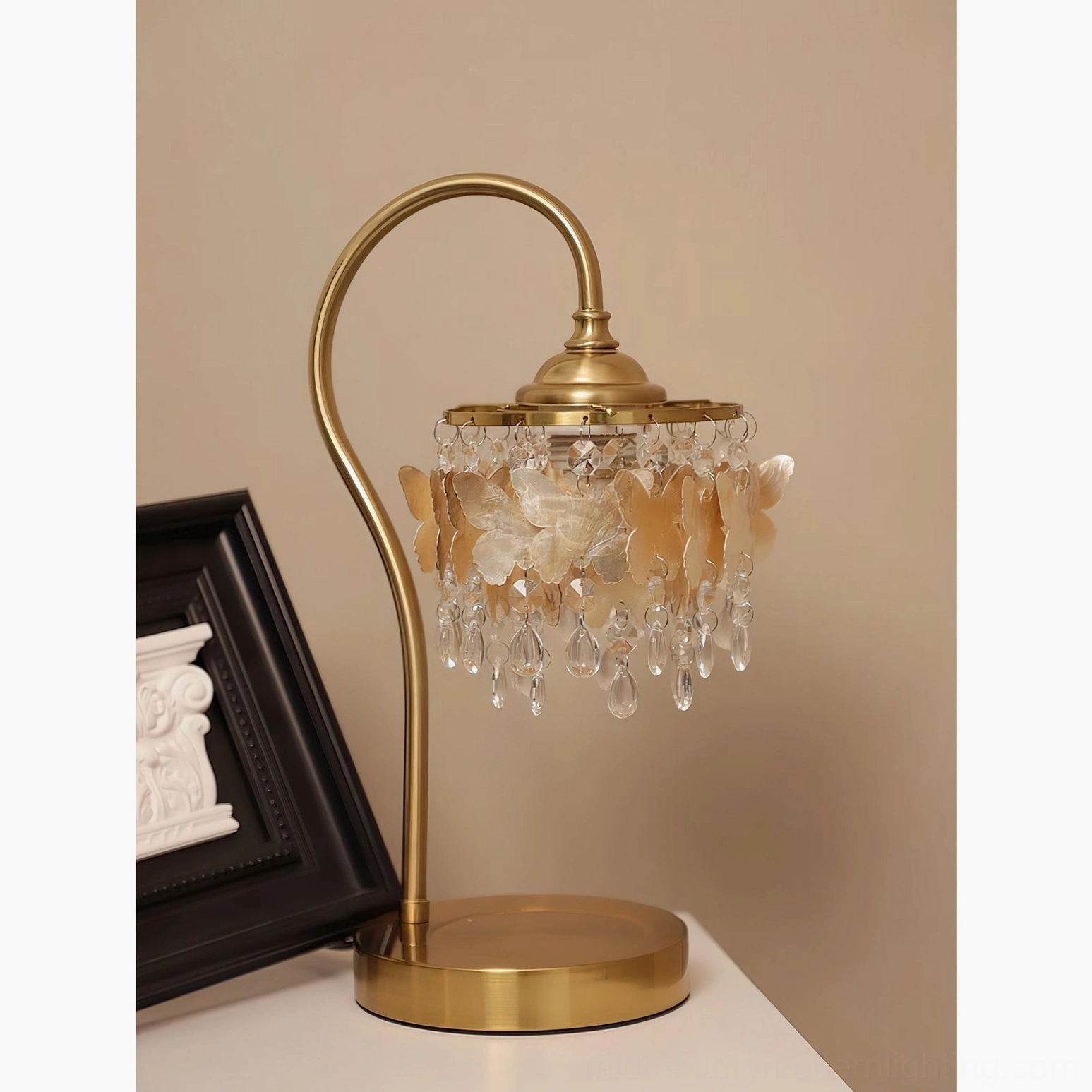 Three-quarter side view of vintage-inspired crystal butterfly table lamp with golden butterfly shade and hanging crystal droplets