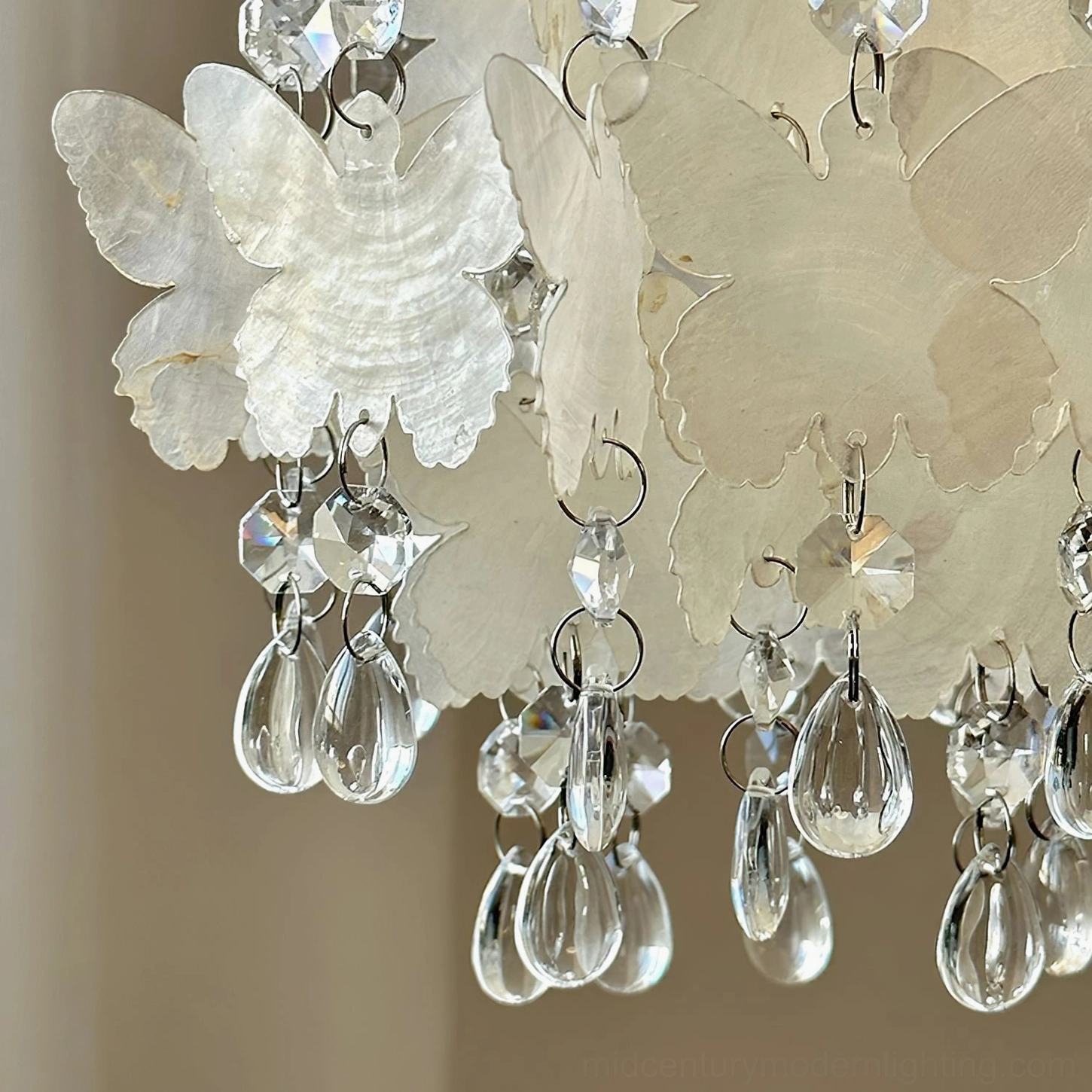 Overhead flat view of Jasinski butterfly pendant decorative section featuring frosted butterfly panels, teardrop crystal pendants and metal hanging loops